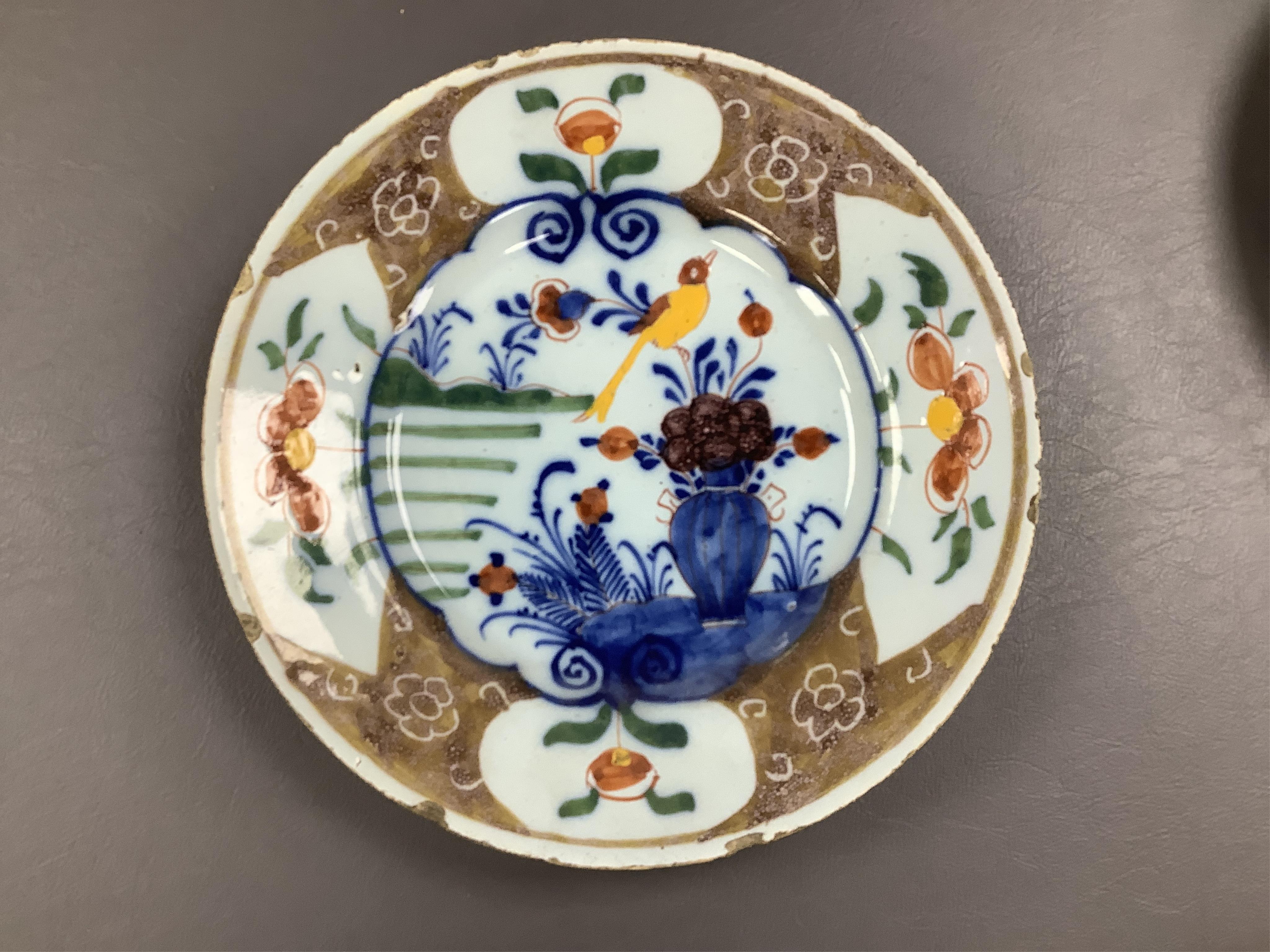 18th and 19th century faience including five chargers and large bowl, latter 30cm